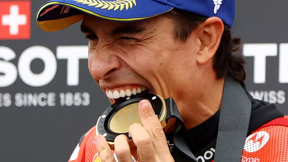 MotoGP - German Grand Prix - Sachsenring, Hohenstein-Ernstthal, Germany - July 12, 2025 Ducati Lenovo Team's Marc Marquez celebrates with his medal after winning the sprint race REUTERS/Lisi Niesner   TPX IMAGES OF THE DAY