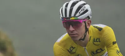 Slovenia's Tadej Pogacar, wearing the overall leader's yellow jersey, speeds down Aspin pass during the fourteenth stage of the Tour de France cycling race over 182.6 kilometers (113.5 miles) with start in Pau and finish in Luchon Superbagneres, France, Saturday, July 19, 2025. (AP Photo/Thibault Camus)