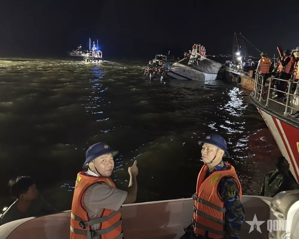 This image from a video provided by QDND shows rescue workers searching for people after a tourist boat capsized in Ha Long Bay, Vietnam on Saturday, July 19, 2025. (QDND via AP)