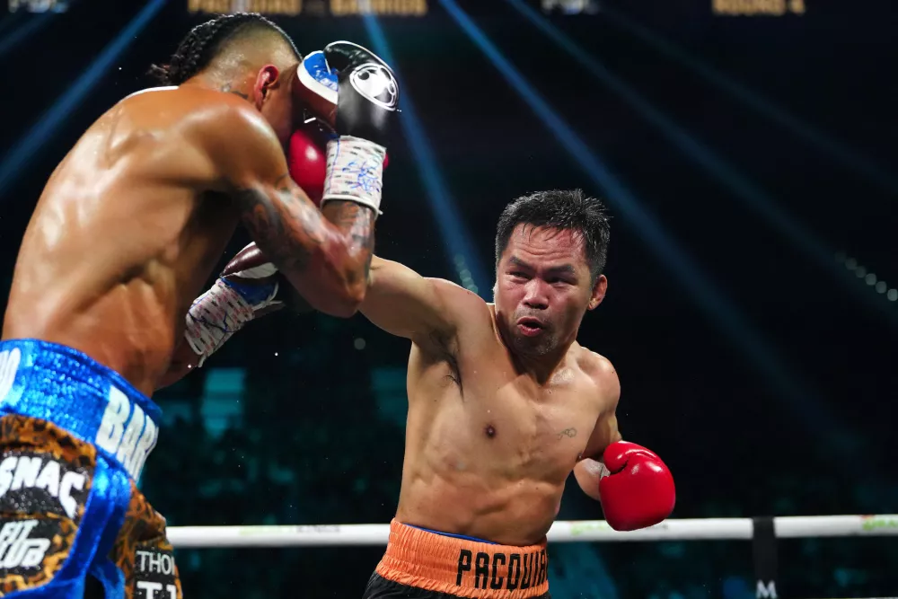 Jul 19, 2025; Las Vegas, Nevada, USA; Manny Pacquiao fights Mario Barrios at MGM Grand Garden Arena. Mandatory Credit: Stephen R. Sylvanie-Imagn Images