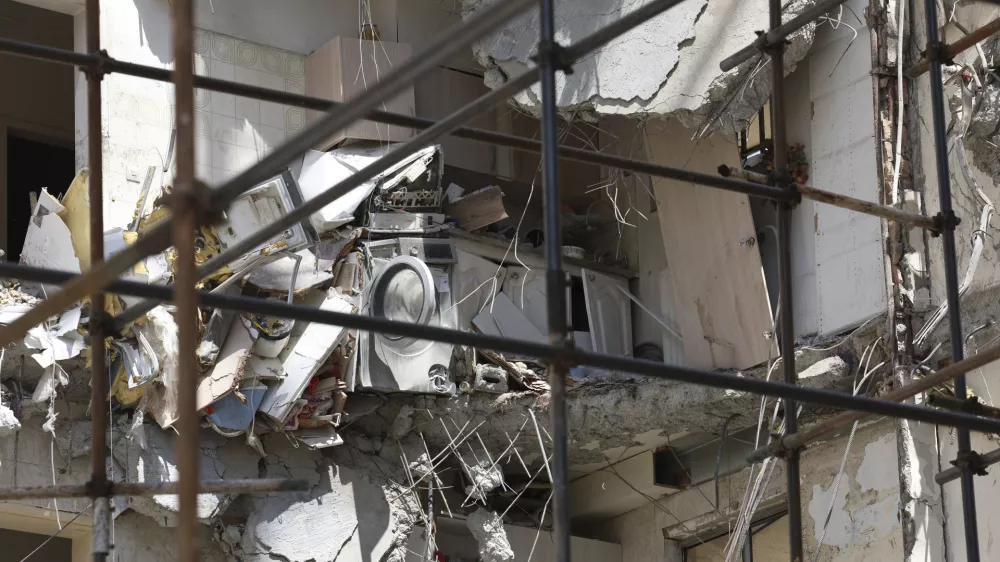Damage from a deadly June 13 Israeli airstrike is seen on a building at a residential compound in Tehran, Iran, on Saturday, July 19, 2025. (AP Photo)