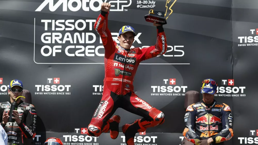 MotoGP - Czech Republic Grand Prix - Masaryk Circuit, Brno, Czech Republic - July 20, 2025 Ducati Lenovo Team's Marc Marquez celebrates with a trophy on the podium after winning the MotoGP race REUTERS/David W Cerny