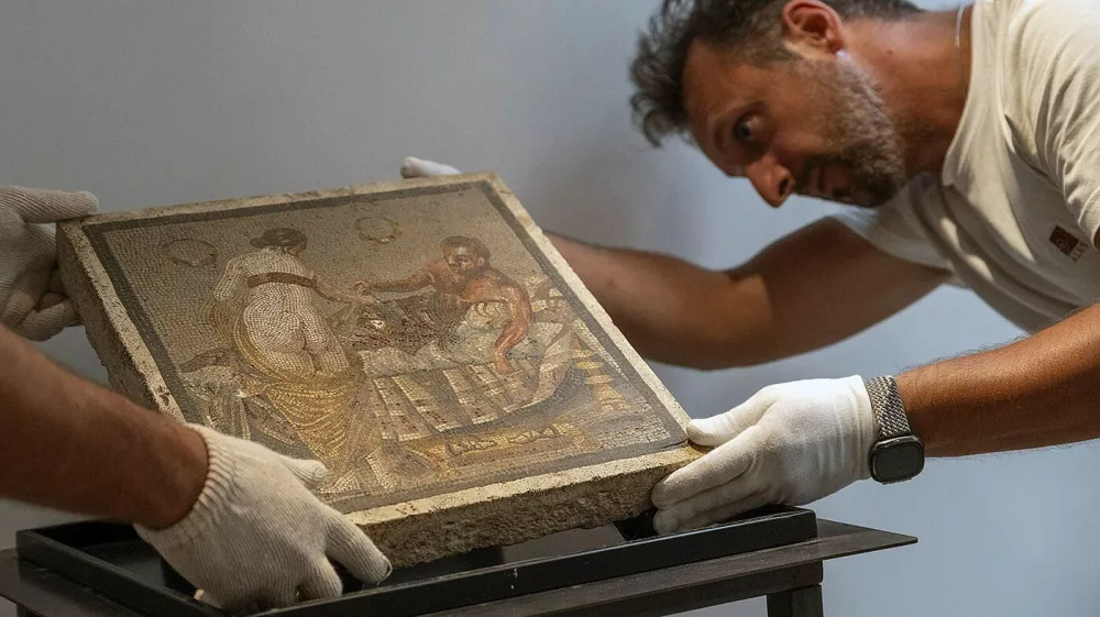 An erotic Ancient Roman mosaic stolen by a Wehrmacht officer in 1944 and given to a German citizen was returned to its rightful home at Pompeii, Italy in a ceremony by Italy's crack art cops on July 15, 2025. The German army captain, responsible for the military supply chain in Italy during World War II, handed over the mosaic of a pair of lovers in an erotic scene to a German citizen whose family have now returned it thanks to the Carabinieri of the Cultural Heritage Protection Unit (TPC) of Rome. The work of great cultural interest dates between the mid-last century BC and the 1st century AD. Repatriated from Germany through a diplomatic expedition, the mosaic most likely decorated the floor of a private room reserved for the master of the house. The work is likely from the Vesuvian area, perhaps from a villa in the Pompeian suburbs. The paramilitary personnel of the Cultural Heritage Protection Command in Rome, realizing they were dealing with a work of extraordinary cultural interest and, among other things, linked to the wartime plundering of artworks belonging to the Italian state heritage, conducted the necessary investigations to establish its authenticity and provenance. Photo by (EV) Parco Pompei/ ABACAPRESS.COM,Image: 1022160447, License: Rights-managed, Restrictions: Usage restrictions: Advertising and promotion,Commercial electronic,Consumer goods,Direct mail and brochures,Indoor display,Internal business usage,Personal use, Model Release: noFoto: Profimedia