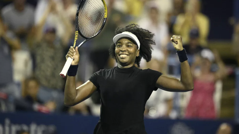 Venus Williams celebrates her win over Peyton Stearns during a match at the Citi Open tennis tournament Tuesday, July 22, 2025, in Washington. (AP Photo/Nick Wass)