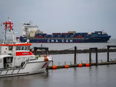 CMA CGM PREGOLIA, container freighter flying the flag of Malta, in the Elbe estuary, rescue cruiser, ANNELIESE KRAMER, in harbour, Cuxhaven, Lower Saxony, Germany, Europe,Image: 892175615, License: Rights-managed, Restrictions:, Model Release: no