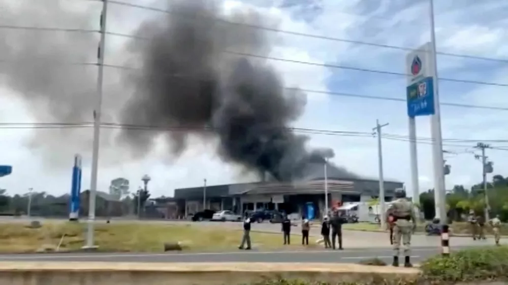 Smoke rises from a convenience store at a gas station, amid the clashes between Thailand and Cambodia, in Kantharalak district, Sisaket province, Thailand, July 24, 2025, in this screengrab obtained from a handout video. TPBS/Handout via REUTERS  THIS IMAGE HAS BEEN SUPPLIED BY A THIRD PARTY. THAILAND OUT. NO COMMERCIAL OR EDITORIAL SALES IN THAILAND.