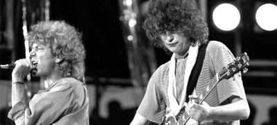 FILE - In this July 13, 1985 file photo, singer Robert Plant, left, and guitarist Jimmy Page of the British rock band Led Zeppelin perform at the Live Aid concert at Philadelphia's J.F.K. Stadium. Generations of aspiring guitarists have tried to copy the riff from Led Zeppelin's â€śStairway to Heaven.â€ť Starting Tuesday, June 14, 2016, a Los Angeles court will try to decide whether the members of Led Zeppelin themselves ripped off that riff. Page and Plant are named as defendants in the lawsuit brought by the trustee of late guitarist Randy Wolfe from the band Spirit. (AP Photo/Rusty Kennedy, File)
