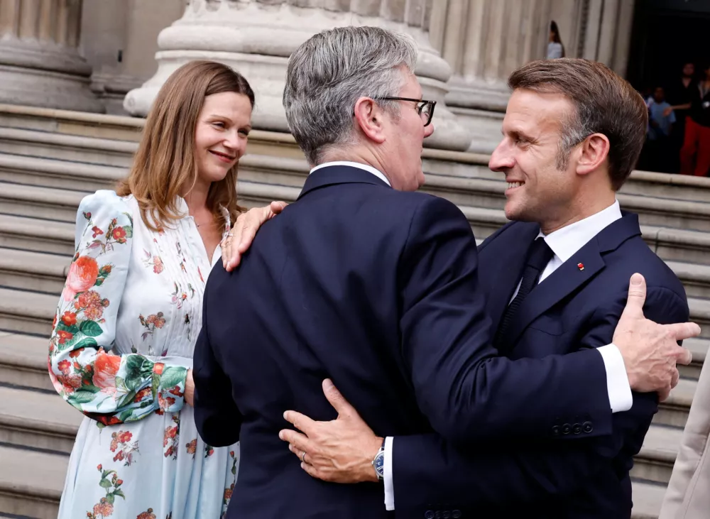 France's President Emmanuel Macron alongside Britain's Prime Minister Keir Starmer (2L) and his wife Victoria Starmer, as they depart following a visit to The British Museum in London, on July 9, 2025.   BENJAMIN CREMEL/Pool via REUTERS