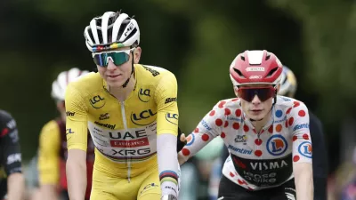 Cycling - Tour de France - Stage 20 - Nantua to Pontarlier - Pontarlier, France - July 26, 2025 UAE Team Emirates XRG's Tadej Pogacar and Team Visma | Lease a Bike's Jonas Vingegaard cross the finish line after stage 20 REUTERS/Benoit Tessier