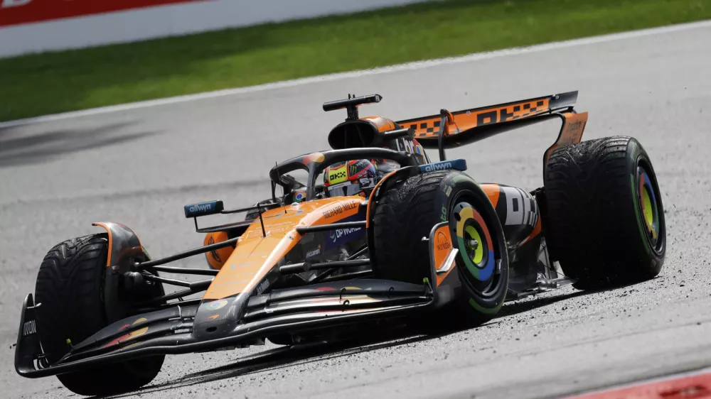 McLaren driver Oscar Piastri of Australia steers his car during the Formula One Grand Prix at the Spa-Francorchamps racetrack in Spa, Belgium, Sunday, July 27, 2025. (AP Photo/Geert Vanden Wijngaert)