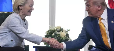 President Donald Trump and European Commission President Ursula von der Leyen shake hands after reaching a trade deal at the Trump Turnberry golf course in Turnberry, Scotland Sunday, July 27, 2025. (AP Photo/Jacquelyn Martin)