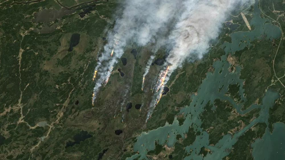 A satellite image shows smoke rising from wildfires in Manitoba, Canada, May 27, 2025. European Union/Copernicus Sentinel-2/Handout via REUTERS  THIS IMAGE HAS BEEN SUPPLIED BY A THIRD PARTY. MANDATORY CREDIT. NO RESALES. NO ARCHIVES. PICTURES HAVE BEEN ENHANCED FROM THE SOURCE TO VISUALISE THE INFRARED EMISSIONS OF THE ACTIVE FIRES.