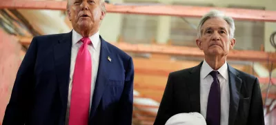 FILE PHOTO: U.S. President Donald Trump and Federal Reserve Chair Jerome Powell speak during a tour of the Federal Reserve Board building, which is currently undergoing renovations, in Washington, D.C., U.S., July 24, 2025. REUTERS/Kent Nishimura/File Photo