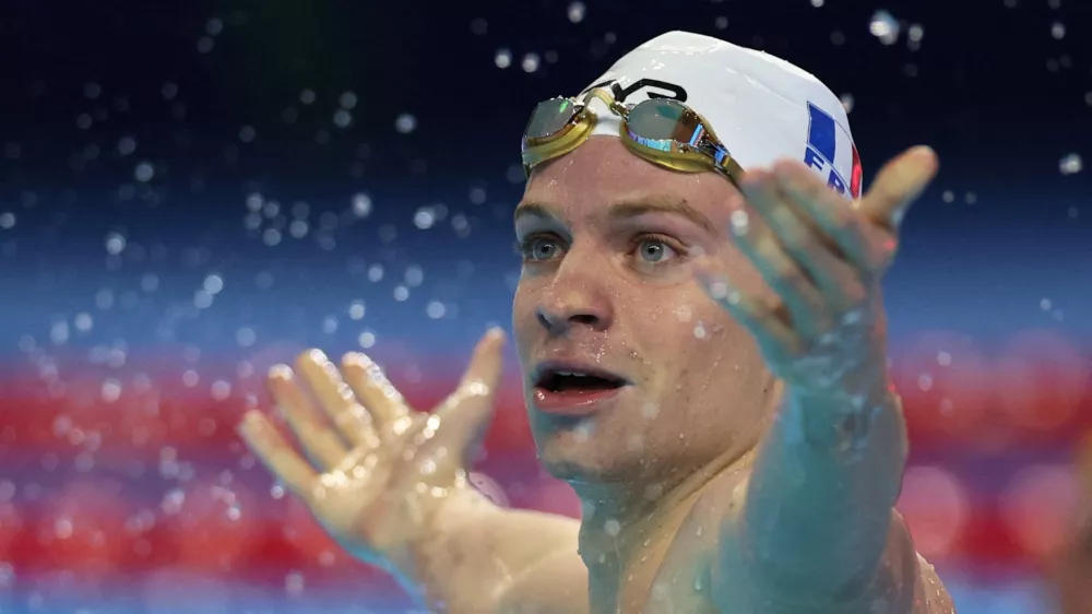 Swimming - World Aquatics Championships - Men 200m Medley - Semifinals - World Aquatics Championships Arena, Singapore - July 30, 2025 France's Leon Marchand celebrates after winning semifinal 2 REUTERS/Jeremy Lee   TPX IMAGES OF THE DAY