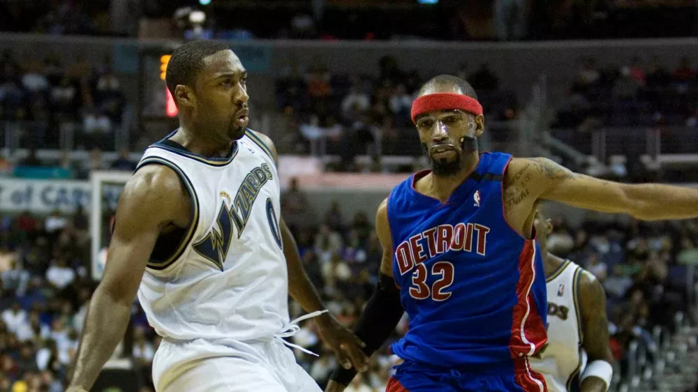 Washington Wizards' Gilbert Arenas, left, is guarded by Detroit Pistons' Richard Hamilton (32) during the second half of an NBA basketball game, Saturday, March 28, 2009, in Washington. The Pistons won 98-96. (AP Photo/Manuel Balce Ceneta)