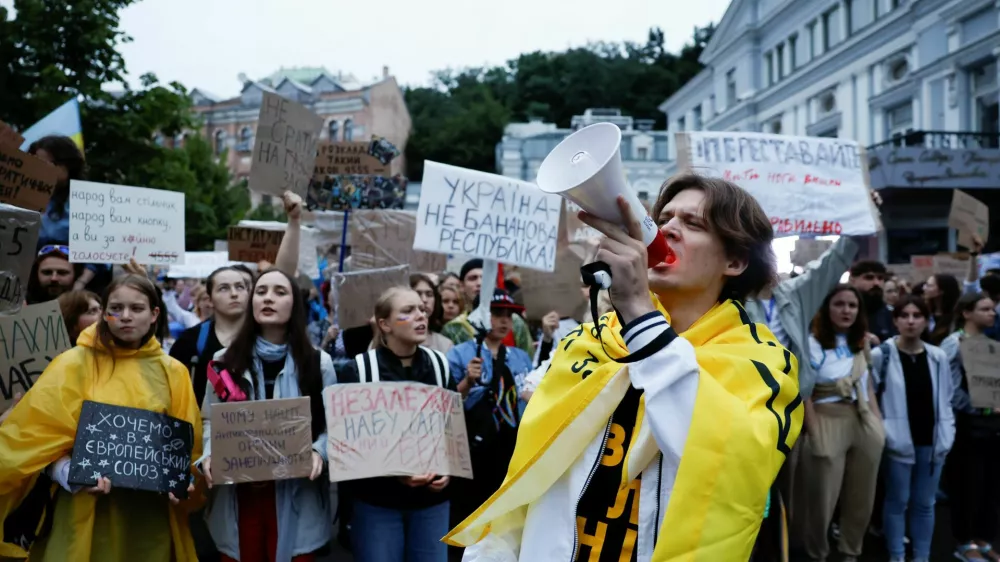 A protester uses a megaphone during a rally ahead of a vote in parliament on Thursday, in which lawmakers will consider restoring the independence of two key anti-corruption agencies, amid Russia's attack on Ukraine, in Kyiv, Ukraine, July 30, 2025. REUTERS/Thomas Peter