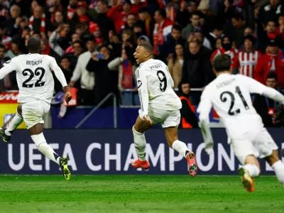 FILE PHOTO: Soccer Football - Champions League - Round of 16 - Second Leg - Atletico Madrid v Real Madrid - Metropolitano, Madrid, Spain - March 12, 2025 Real Madrid's Kylian Mbappe and Antonio Rudiger celebrate after the match REUTERS/Susana Vera/File Photo