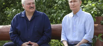 Russian President Vladimir Putin, right, and Belarusian President Alexander Lukashenko sit on a bench during their visit to the Smolensky Skete of Valaam Monastery at Valaam island in Ladoga lake, Republic of Karelia, Russia, Friday, Aug. 1, 2025. (Gavriil Grigorov, Sputnik, Kremlin Pool Photo via AP)