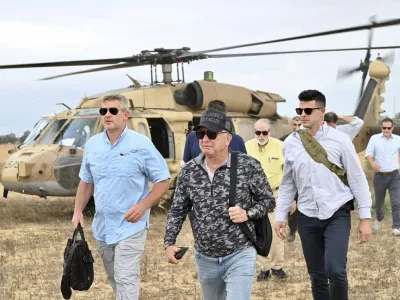 This handout photo from US Embassy Jerusalem shows White House special envoy Steve Witkoff, center, visiting a food distribution site run by the Gaza Humanitarian Foundation, a U.S.-backed organization approved by Israel, in the Gaza Strip Friday, Aug. 1, 2025. (David Azaguri/US Embassy Jerusalem via AP)