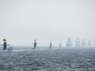 ﻿Chinese Navy submarines and warships take part in an international fleet review to celebrate the 60th anniversary of the founding of the People's Liberation Army Navy in Qingdao, Shandong province, in this April 23, 2009 file photo. To match Special Report BREAKOUT-SUBMARINES/   REUTERS/Guang Niu/Pool/Files (CHINA - Tags: MILITARY POLITICS ANNIVERSARY)