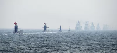 ﻿Chinese Navy submarines and warships take part in an international fleet review to celebrate the 60th anniversary of the founding of the People's Liberation Army Navy in Qingdao, Shandong province, in this April 23, 2009 file photo. To match Special Report BREAKOUT-SUBMARINES/   REUTERS/Guang Niu/Pool/Files (CHINA - Tags: MILITARY POLITICS ANNIVERSARY)