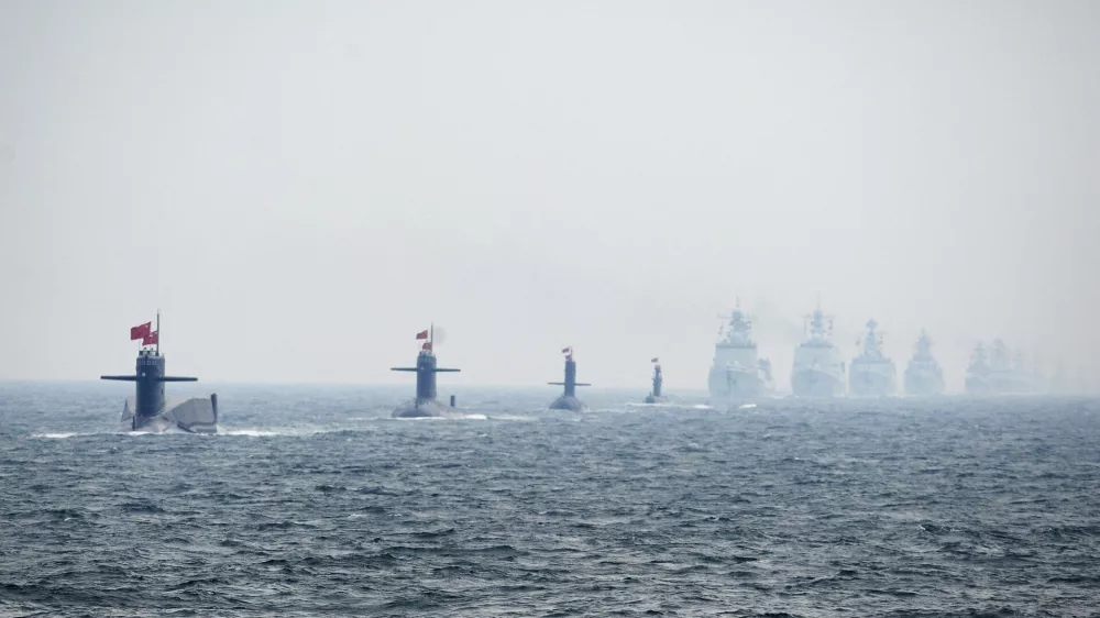 ﻿Chinese Navy submarines and warships take part in an international fleet review to celebrate the 60th anniversary of the founding of the People's Liberation Army Navy in Qingdao, Shandong province, in this April 23, 2009 file photo. To match Special Report BREAKOUT-SUBMARINES/   REUTERS/Guang Niu/Pool/Files (CHINA - Tags: MILITARY POLITICS ANNIVERSARY)