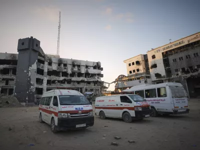 Ambulances are parked next to the main buildings of Shifa Hospital in Gaza City, Friday, July 4, 2025. (AP Photo/Jehad Alshrafi)