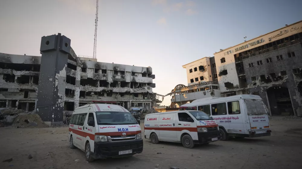 Ambulances are parked next to the main buildings of Shifa Hospital in Gaza City, Friday, July 4, 2025. (AP Photo/Jehad Alshrafi)