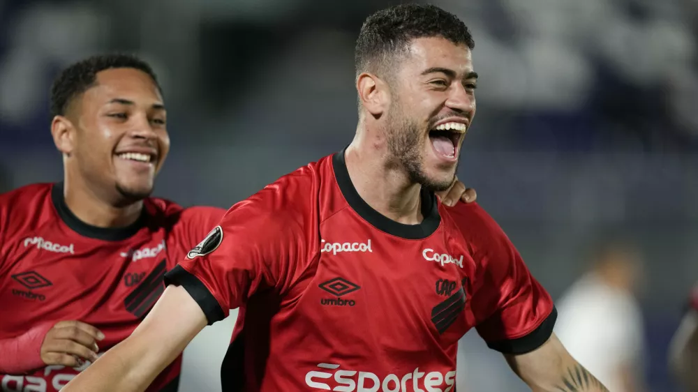 FILE - Romûlo of Brazil's Athletico Paranaense, right, celebrates scoring his side's opening goal against Paraguay's Libertad during a Copa Libertadores Group G soccer match at Defensores del Chaco stadium in Asuncion, Paraguay, Thursday, May 4, 2023. (AP Photo/Jorge Saenz, file)