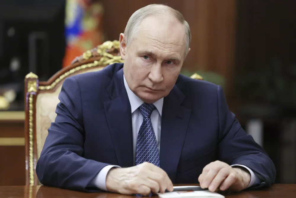 Russian President Vladimir Putin speaks with Igor Shuvalov, the chairman of the Russian state development corporation VEB.RF, during their meeting at the Kremlin in Moscow, Russia, Tuesday, Aug. 5, 2025. (Mikhail Metzel, Sputnik, Kremlin Pool Photo via AP)