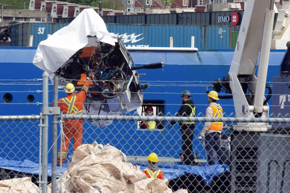 FILE - Debris from the Titan submersible, recovered from the ocean floor near the wreck of the Titanic, is unloaded from the ship Horizon Arctic at the Canadian Coast Guard pier in St. John's, Newfoundland, Wednesday, June 28, 2023. (Paul Daly/The Canadian Press via AP, File)