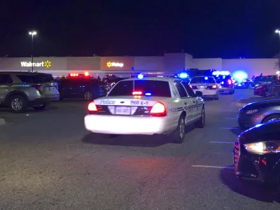 In this image from video Virginia police respond to the scene of a fatal shooting at a Walmart on Tuesday night, Nov. 22, 2022, in Chesapeake, Va. (WAVY-TV 10 via AP)