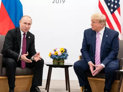 FILED - 14 June 2019, Japan, Osaka: US President Donald Trump (R) shakes hands with Russian President Vladimir Putin during their meeting on the sidelines of the 2019 G20 summit. Photo: -/White House/dpa - ATTENTION: editorial use only and only if the credit mentioned above is referenced in full