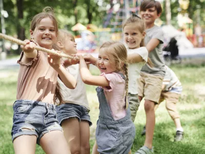 Group of kids playing tug of war