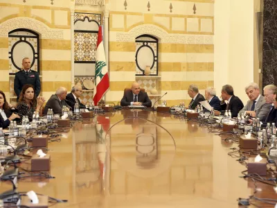 In this photo, released by the Lebanese Presidency press office, Lebanese president Joseph Aoun, centre, leads a Cabinet meeting which supposed to discuss the disarmament of Hezbollah, at the presidential palace in Baabda, east of Beirut, Lebanon, Thursday, Aug. 7, 2025. (Lebanese Presidency press office via AP)