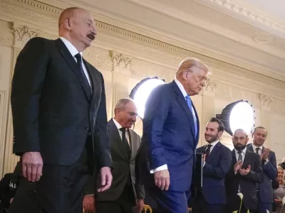 Azerbaijan's President Ilham Aliyev, from left, Armenian Prime Minister Nikol Pashinyan and President Donald Trump arrive for a trilateral signing ceremony in the State Dining Room of the White House, Friday, Aug. 8, 2025, in Washington. (AP Photo/Mark Schiefelbein)