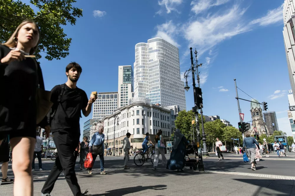 July 3, 2025, Berlin, Berlin, Germany: Pedestrians crossed sunlit streets and browsed storefronts in Berlinâ€s Charlottenburg district on July 3, 2025, as Germany faces ongoing economic headwinds. The scenes of daily life come amid broader concerns over the countryâ€s labor market. Official figures this week showed unemployment stubbornly high, with industrial job losses mounting despite a booming defense sector fueled by European rearmament. More than 100,000 jobs have disappeared from the metal and electronics industries in the past year alone, contributing to fears of long-term deindustrialization in Europeâ€s largest economy. The Charlottenburg district, a bustling west Berlin neighborhood known for its retail streets and cafÃs, reflects both resilience and uncertainty. Tourists and Berliners alike filled sidewalks, offering a snapshot of urban life against the backdrop of shifting economic tides. German leaders have warned of tough months ahead as energy prices, global competition, and structural challenges weigh on traditional industries.,Image: 1018116254, License: Rights-managed, Restrictions:, Model Release: no