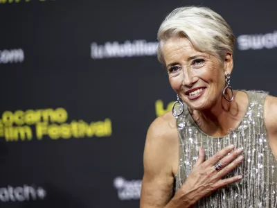 British actress Emma Thompson reacts on the red carpet for the movie "The Dead of Winter" at Piazza Grande square during the 78th Locarno International Film Festival, in Locarno, Switzerland, Friday, Aug. 8, 2025. (Jean-Christophe Bott/Keystone via AP)