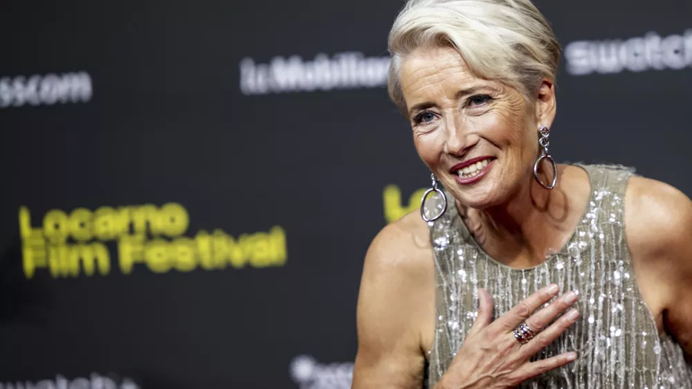 British actress Emma Thompson reacts on the red carpet for the movie "The Dead of Winter" at Piazza Grande square during the 78th Locarno International Film Festival, in Locarno, Switzerland, Friday, Aug. 8, 2025. (Jean-Christophe Bott/Keystone via AP)