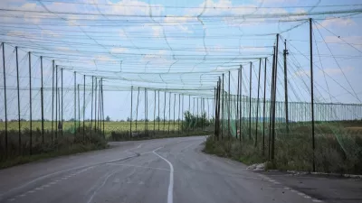 A view of anti-drone nets installed over a road near the frontline town of Dobropillia, amid Russia's attack on Ukraine, in Donetsk region, Ukraine August 10, 2025. REUTERS/Oleksandr Ratushniak
