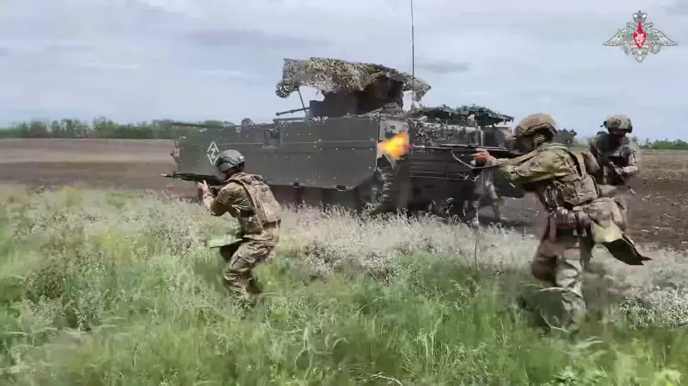 In this photo taken from video distributed by Russian Defense Ministry Press Service on Saturday, July 19, 2025, assault troops of the Russian Army attend a training to hone their combat skills at one of the rear training grounds in an undisclosed location in Ukraine. (Russian Defense Ministry Press Service via AP)