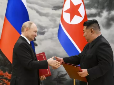 FILE - Russian President Vladimir Putin, left, and North Korea's leader Kim Jong Un exchange documents during a signing ceremony of the new partnership in Pyongyang, North Korea, on June 19, 2024. (Kristina Kormilitsyna, Sputnik, Kremlin Pool Photo via AP, File)