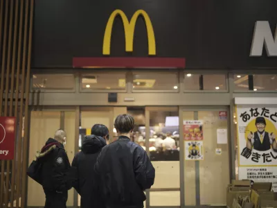 FILE - People stands outside a McDonald's store in Tokyo, March 15, 2024. (AP Photo/Hiro Komae, File)