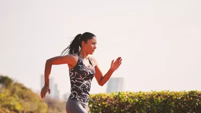 ﻿Sport girl in sporty outfit running at the lane in the park