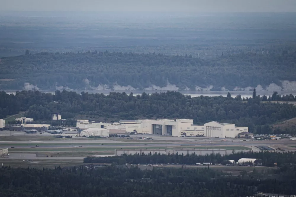 Aircrafts sit at Joint Base Elmendorf-Richardson ahead of a planned meeting between U.S. President Donald Trump and Russian President Vladimir Putin to discuss the war in Ukraine, in Anchorage, Alaska, U.S., August 13, 2025. REUTERS/Jeenah Moon