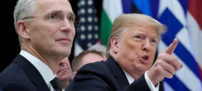 FILE PHOTO: U.S. President Donald Trump gestures next to NATO Secretary General Jens Stoltenberg as they attend a working lunch during the NATO leaders summit in Watford, Britain, December 4, 2019. REUTERS/Kevin Lamarque/File Photo