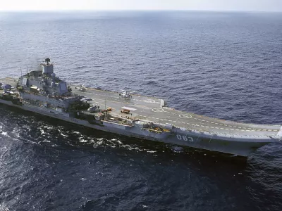 ﻿FILE - In this 2004 file photo the Admiral Kuznetsov carrier seen in the Barents Sea, Russia. The Russian military says one of its the MiG-29 fighter jets based at a Russian aircraft carrier currently near Syria's shores has crashed on a training mission, but its pilot has survived. (AP Photo, File)