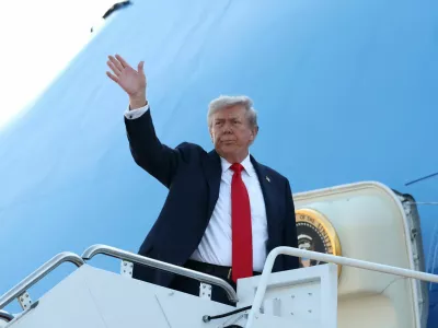 U.S. President Donald Trump boards Air Force One as he departs for Alaska to meet with Russian President Vladimir Putin to negotiate for an end to the war in Ukraine, from Joint Base Andrews in Maryland, U.S., August 15, 2025. REUTERS/Kevin Lamarque