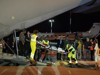 Palestinian children and their families evacuated from Gaza arrive at Rome's Ciampino military airport, Thursday, Aug. 14, 2025. (AP Photo/Gregorio Borgia)