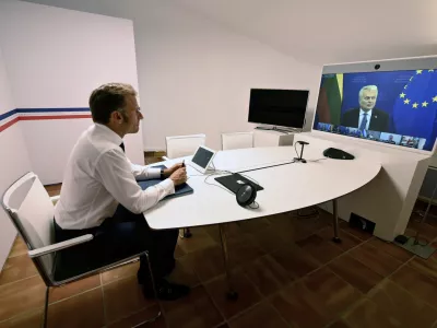 French President Emmanuel Macron listens to Lithuania's President Gitanas Nauseda as he takes part in a video meeting of the so-called "coalition of the willing" to discuss next steps for Ukraine, Monday Aug.19, 2025 at the Fort de Bregancon in Bormes-les-Mimosas, southern France. (Christophe Simon, Pool via AP)